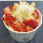 A sundae with fresh strawberrys and bananas. Decadence.